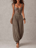 Completo di bandeau in pizzo grigio e pantaloni harem in cotone plissettati
