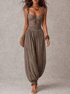 Completo di bandeau in pizzo grigio e pantaloni harem in cotone plissettati